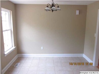 Dining area has tile floors.
