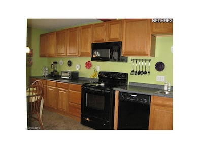 Kitchen with new flooring.  Appliances are include