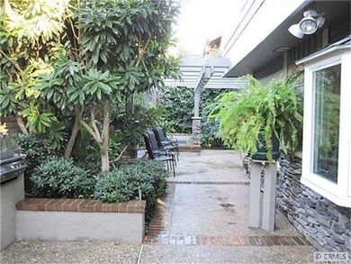 Rear yard view looking toward secluded spa area