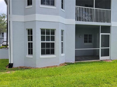 View of side of home with stucco siding and a yard