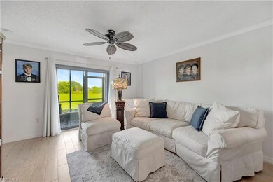 Living room with light hardwood / wood-style floor