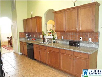 Lovely tile kitchen with granite counters, gas ran