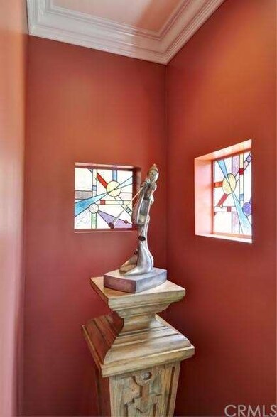 Dining Room nook displaying art & custom stained g
