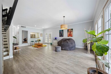 Spacious living/dining area with abundance of natu