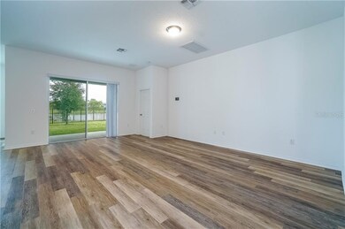 The spacious family room provides sliding glass do