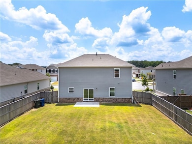 Back of property with a patio, a fenced backyard, and a residential view