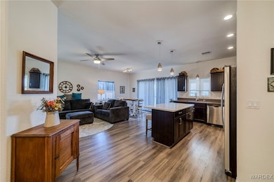 Kitchen featuring decorative light fixtures, stain