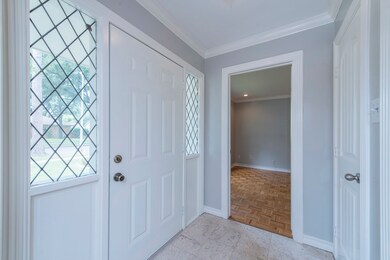 Entry, formal living, converted to 4th bedroom. Could also be used as home office!