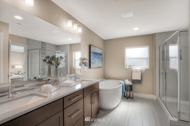 Five piece primary en suite bathroom. Photo of Newhalem 2 D previously built model home is used for representation purposes. Orientation, colors, design elements, and finish details will vary.