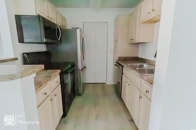 Kitchen featuring dishwasher, light wood finished 