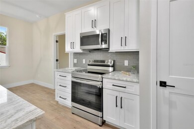 42in upper cabinets with crown molding and light rail.