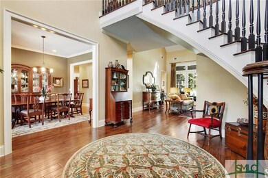 Front foyer flows naturally into formal dining roo
