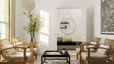 Living area with hardwood / wood-style floors and 