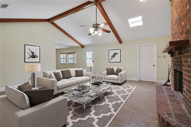 Den with Wood Burning Fireplace and Easy to Mainta