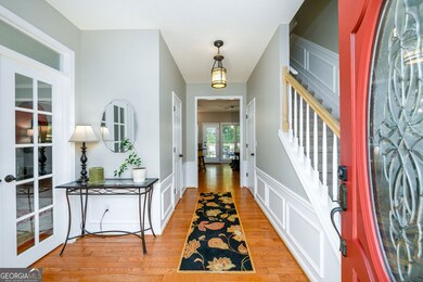 Beautiful entrance with hardwood floors throughout