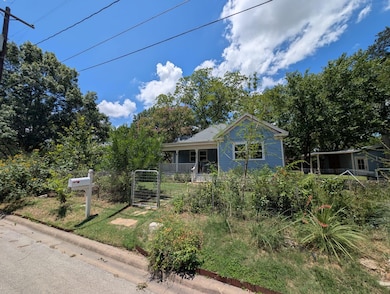 View of front of property featuring a gate