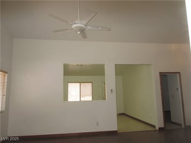 Unfurnished room with a ceiling fan and wood finis