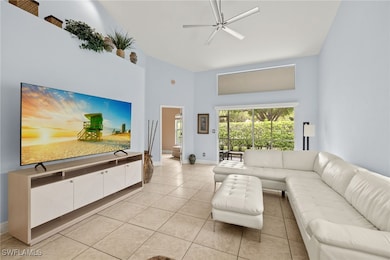Living area with baseboards, light tile patterned