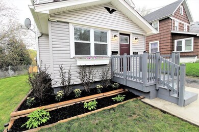 Closer look at lovely landscaping and front porch!