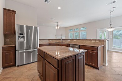 Kitchen featuring appliances with stainless steel