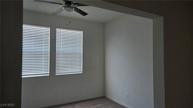 Unfurnished room featuring a ceiling fan, carpet,