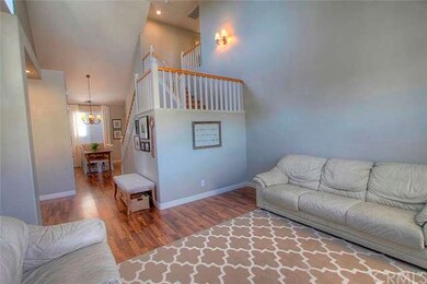 Open floor plan with vaulted ceilings and natural 