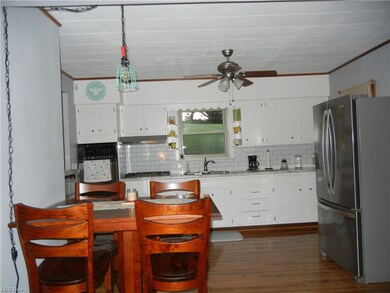 This kitchen and dining area is open with living r
