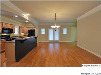 SPACIOUS DINING ROOM WITH HARDWOOD FLOORS...CROWN 