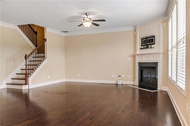 Unfurnished living room featuring a glass covered 