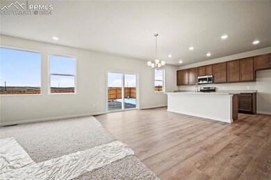 Kitchen with light hardwood / wood-style flooring,