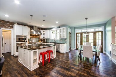 Chef's custom kitchen with gas range, vegetable si