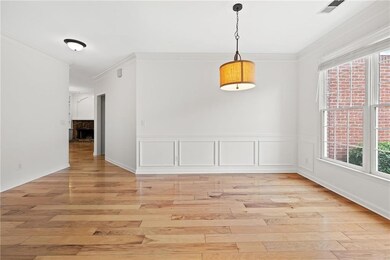 Unfurnished dining area with light wood-style floo