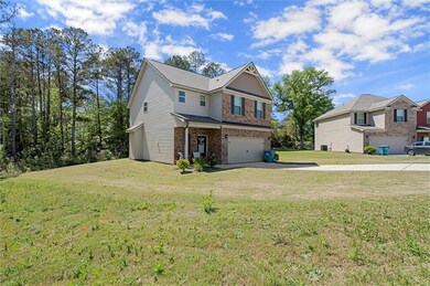 View of front of house featuring driveway, brick s