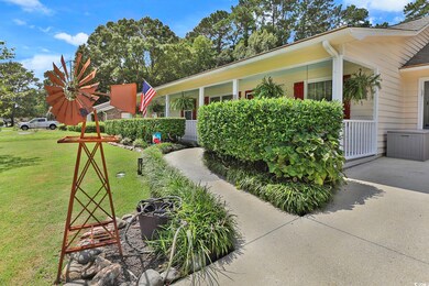 View of side of property featuring a yard
