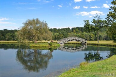 Water view with a heavily wooded area