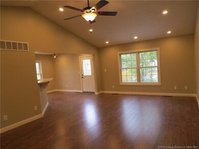 VIEW OF LIVING ROOM W/VAULTED CEILING, RECESSED LI