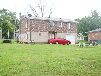 Nice lot and convenient location. Concrete dive wraps around to back of home.