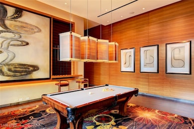Playroom with pool table and wood finished floors