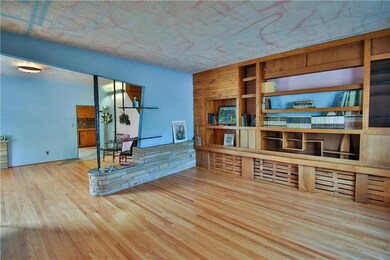 Custom built-ins line the wall of the living room