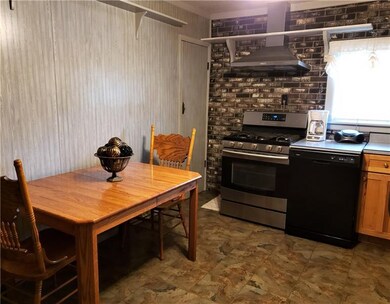 The quaint kitchen comes with a large pantry (door