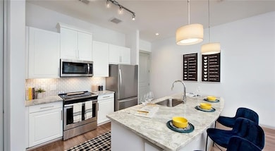 Kitchen with sink, appliances with stainless steel