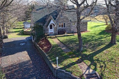This stone home sets on a large homesite with matu