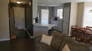 View of kitchen, den, breakfast nook areas