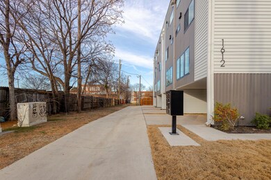 View of home's community with fence