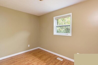 Unfurnished room featuring light wood-type flooring and baseboards
