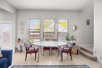 Dining area with light tile patterned floors and 