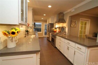 View of kitchen with pass thru to dining area