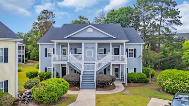 View of front of house featuring covered porch, ro