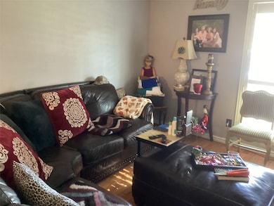 Living room featuring wood finished floors and baseboards