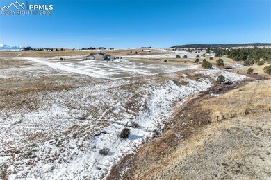 Snowy aerial view with a rural view